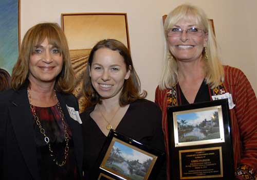 This year's Citizen Appreciation Award was given to Greg Parkos for his many contributions to the Venice Canals Community. VCA Vice President Rene Kaplan (left) presents plaques to January Parkos Arnall and Nadine Parkos.