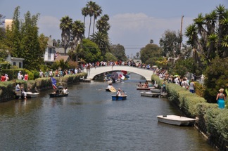 a huge crowd lines the Canal banks and Dell bridge to watch the 8th Annual Rubber Ducky Race and Linnie Canal Downwind Regatta